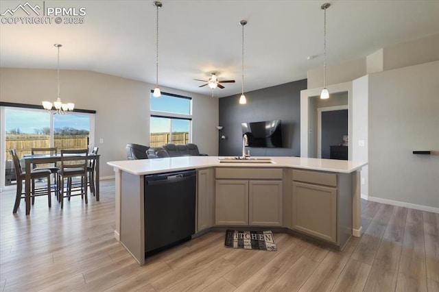 kitchen featuring sink, an island with sink, black dishwasher, and light wood-type flooring