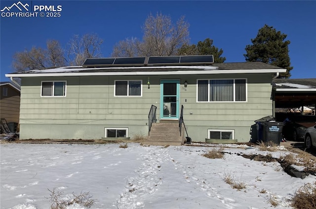 view of front of property with solar panels