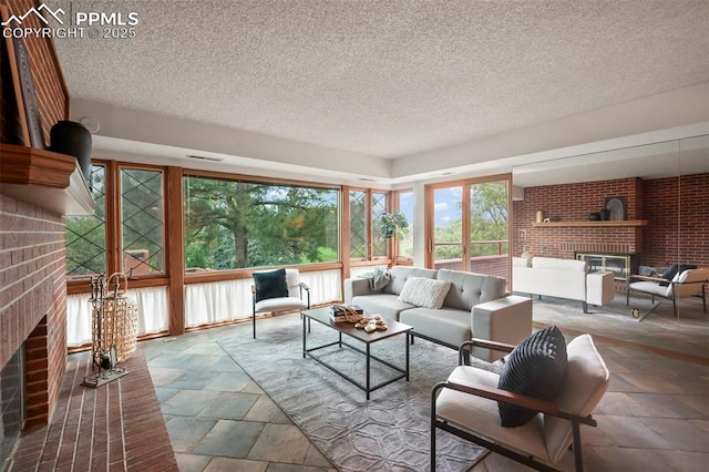 sunroom / solarium with a fireplace