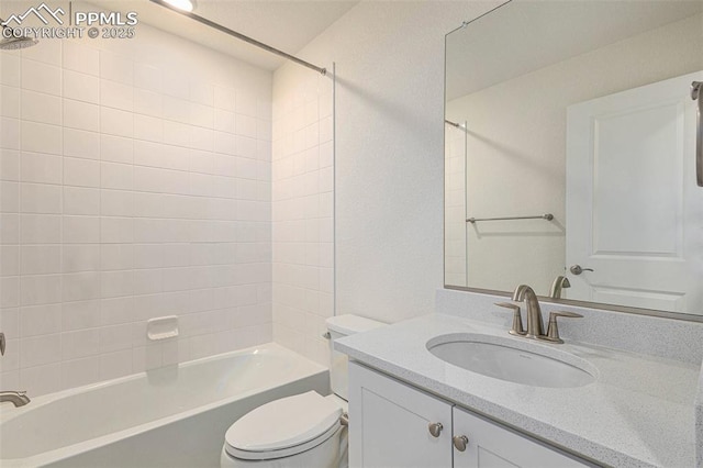 full bathroom with vanity, toilet, and tiled shower / bath combo