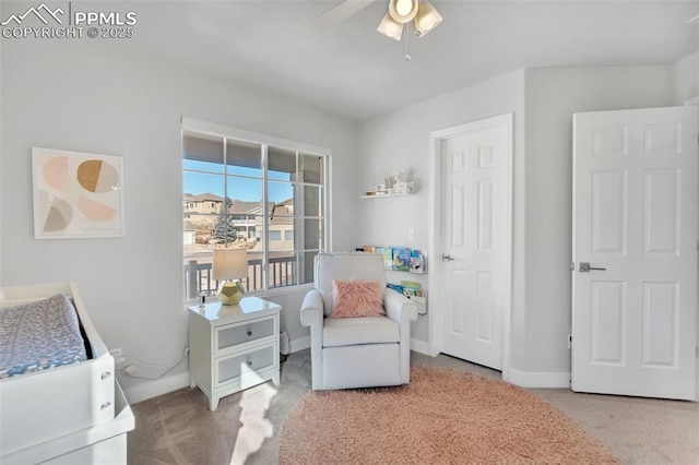 sitting room with carpet floors and ceiling fan