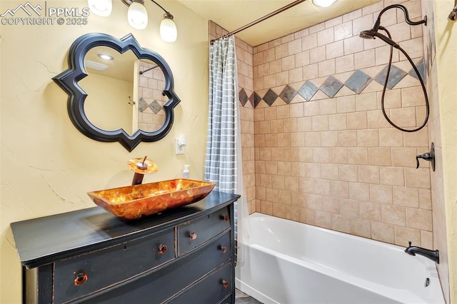 bathroom featuring shower / tub combo and vanity