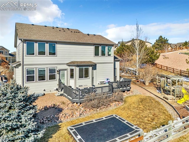 back of house featuring a wooden deck