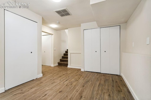 basement featuring hardwood / wood-style floors