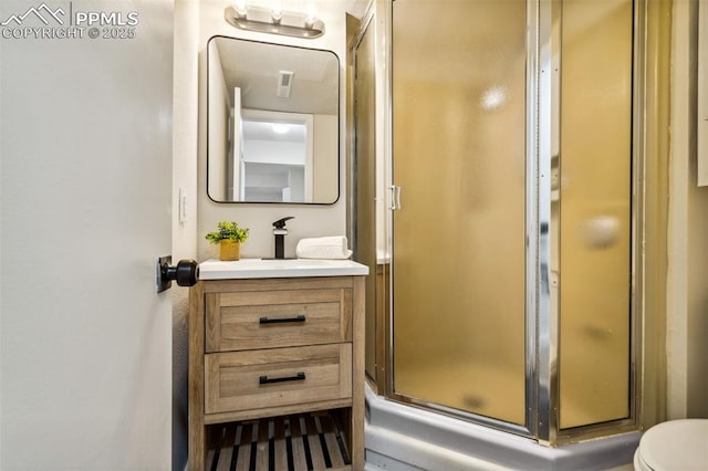 bathroom featuring vanity and walk in shower