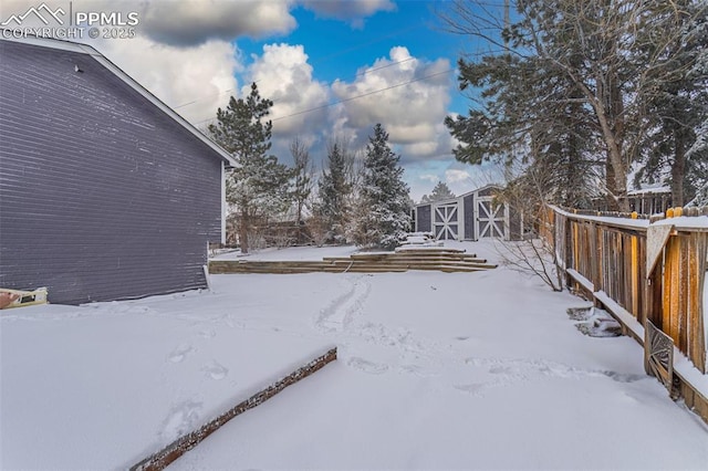 view of yard layered in snow