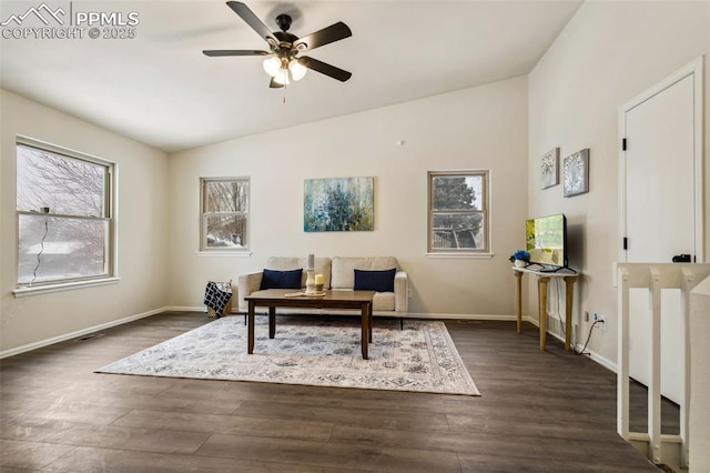 sitting room with dark wood-type flooring, ceiling fan, and vaulted ceiling