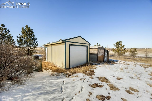 view of snow covered garage