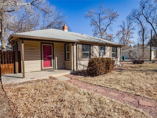 single story home with a porch