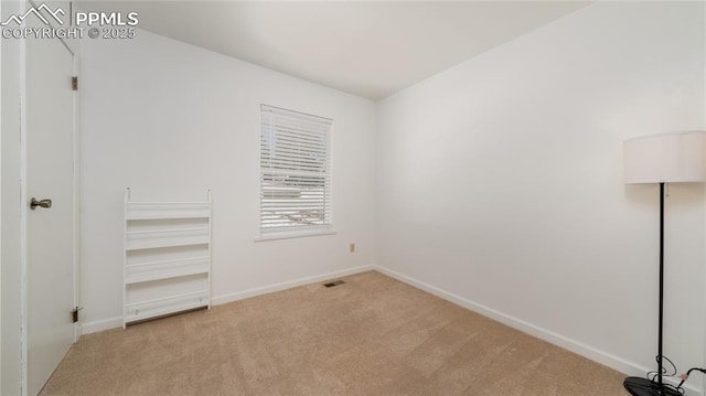 unfurnished bedroom featuring light colored carpet