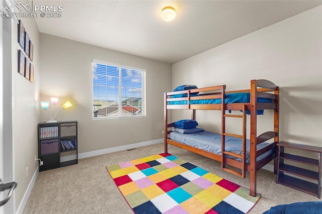 bedroom featuring light colored carpet