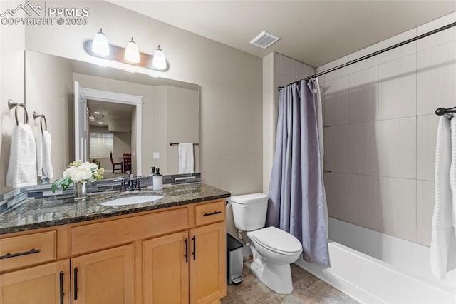 full bathroom with vanity, toilet, and shower / tub combo with curtain