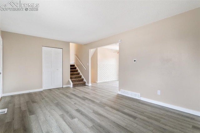 spare room with light hardwood / wood-style floors