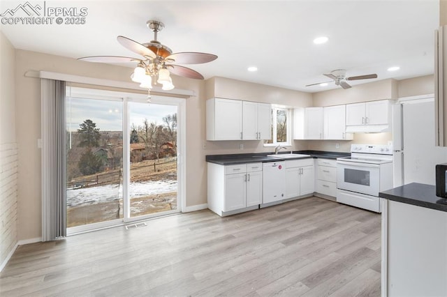 kitchen featuring sink, white cabinetry, ceiling fan, white appliances, and light hardwood / wood-style floors