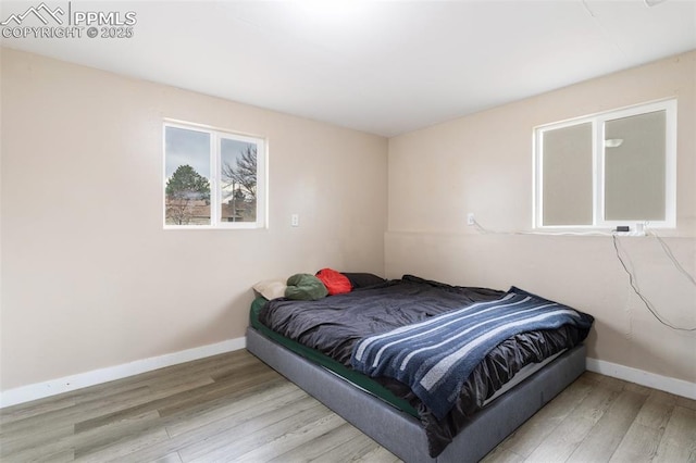 bedroom featuring light hardwood / wood-style floors