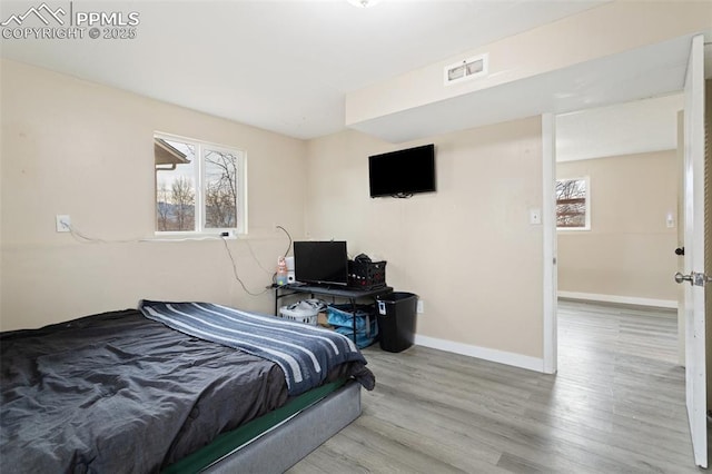 bedroom featuring hardwood / wood-style flooring