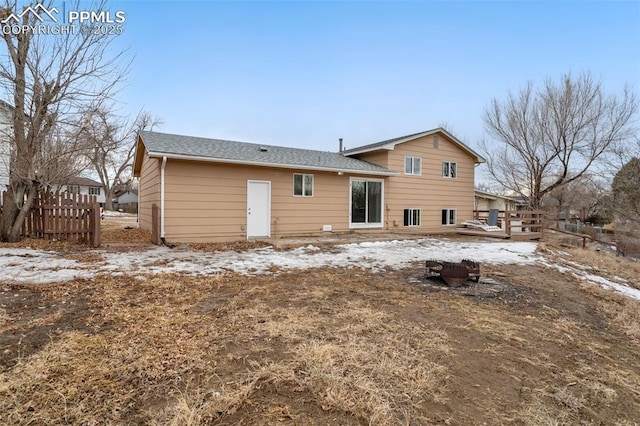 snow covered property featuring a deck