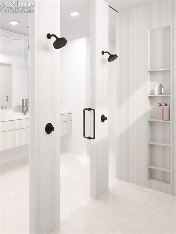 bathroom featuring a shower, tile patterned flooring, and vanity