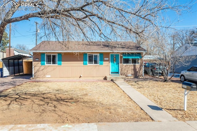 single story home with a carport