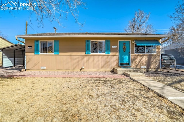 view of front of home featuring a carport