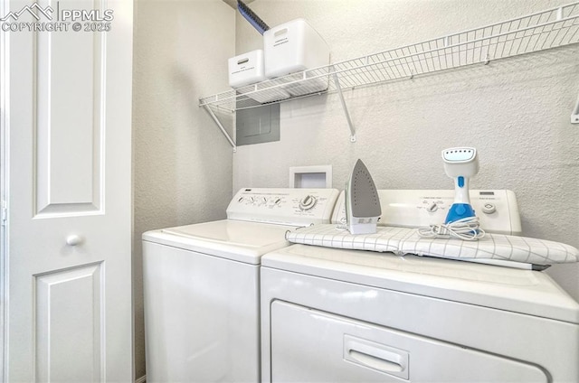 laundry room with washer and dryer