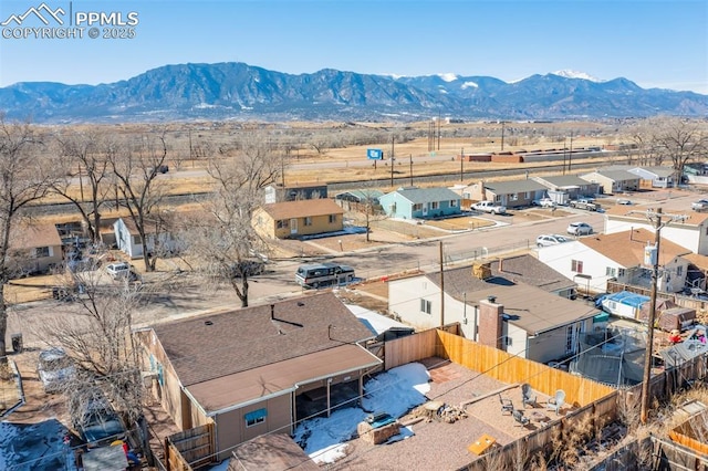 birds eye view of property with a mountain view