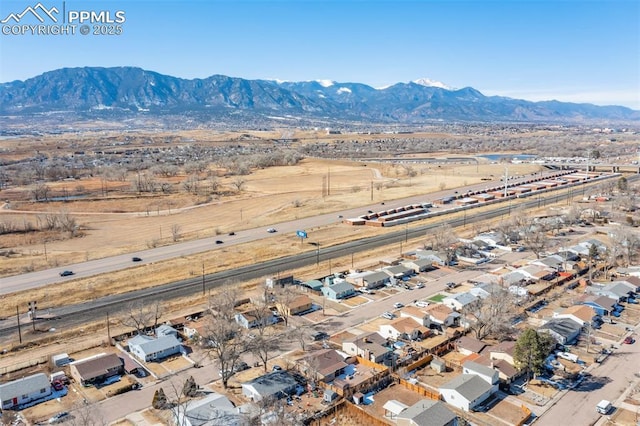 birds eye view of property featuring a mountain view