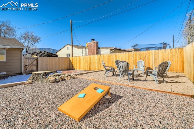 view of yard with a fire pit