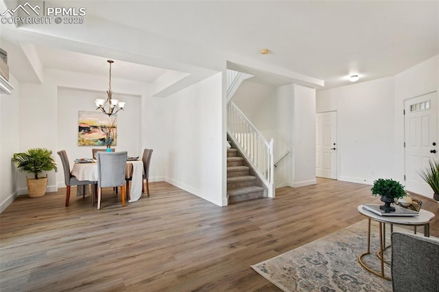 dining room featuring hardwood / wood-style flooring and a notable chandelier