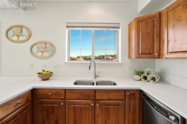 kitchen featuring stainless steel dishwasher and sink