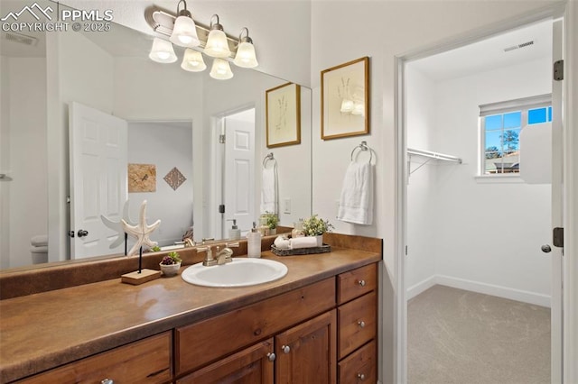 bathroom with vanity and toilet