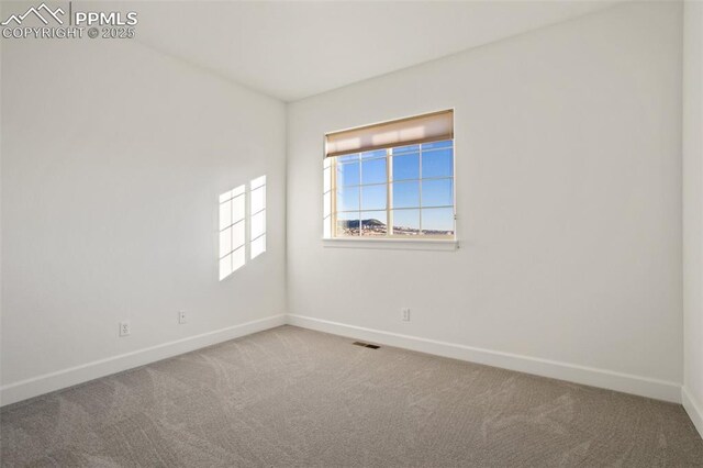 view of carpeted spare room