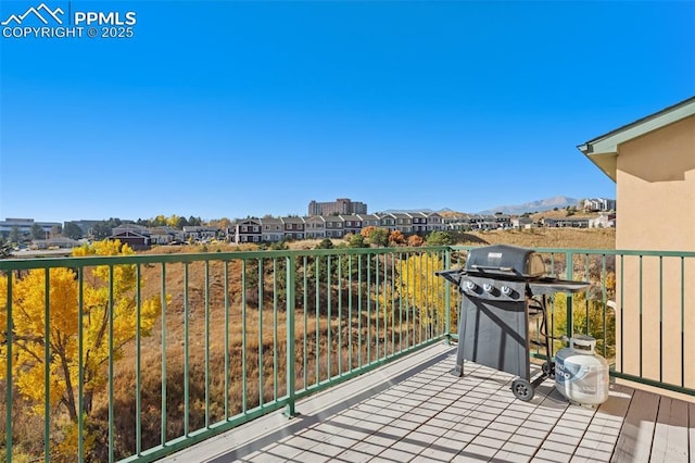 balcony with a grill and a mountain view