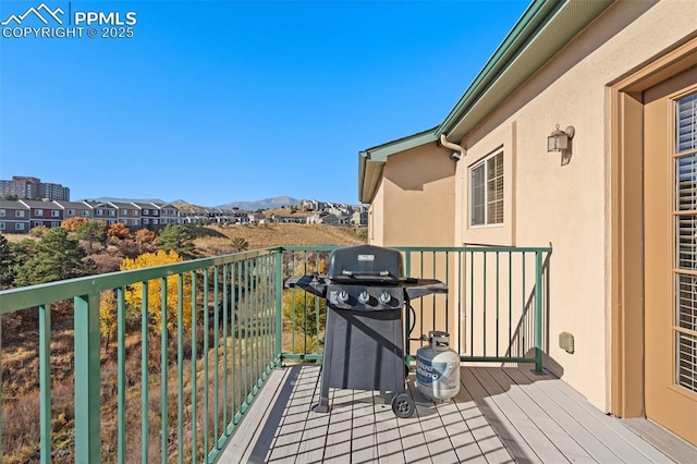 balcony with a mountain view and a grill