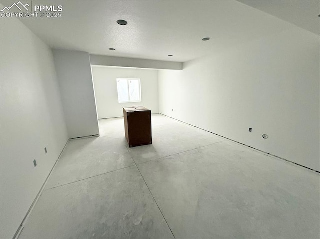 spare room with concrete flooring