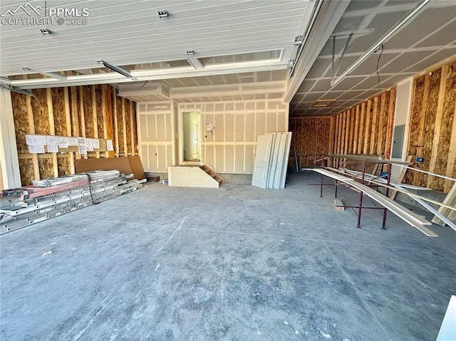 miscellaneous room featuring concrete flooring and a garage