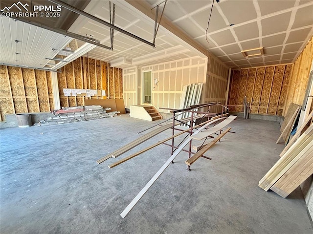 miscellaneous room featuring a garage and concrete flooring