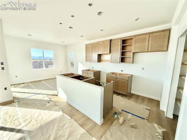 kitchen featuring recessed lighting, light wood-type flooring, and baseboards