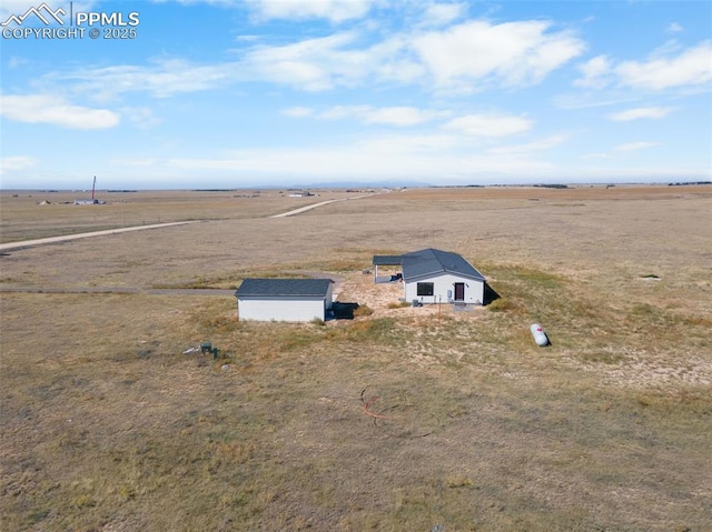 birds eye view of property featuring a rural view