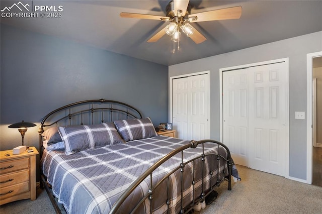 bedroom featuring two closets and ceiling fan