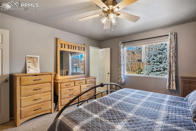 carpeted bedroom featuring ceiling fan