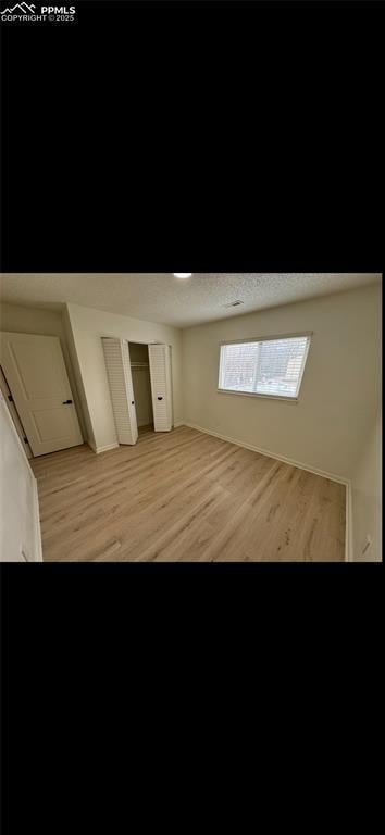 additional living space featuring light hardwood / wood-style floors