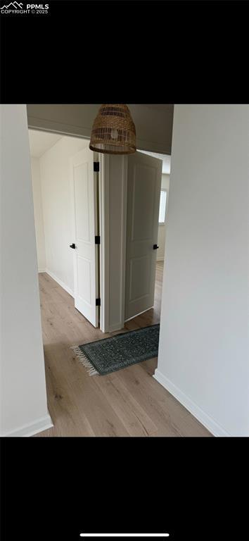 hallway featuring light wood-type flooring