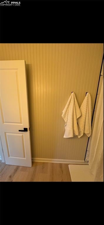 bathroom with hardwood / wood-style floors