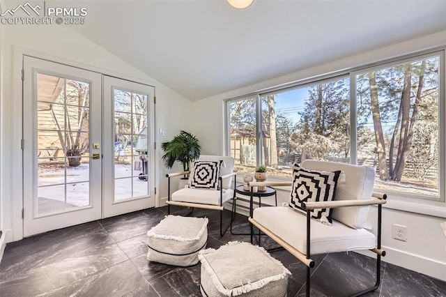 sunroom / solarium featuring vaulted ceiling and french doors