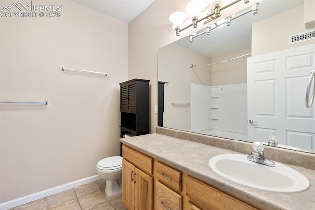 bathroom with walk in shower, vanity, toilet, and tile patterned flooring