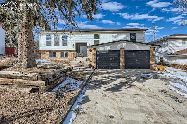 raised ranch featuring a garage