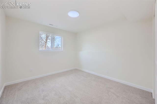 unfurnished room with light carpet