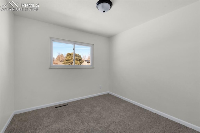 empty room featuring carpet floors