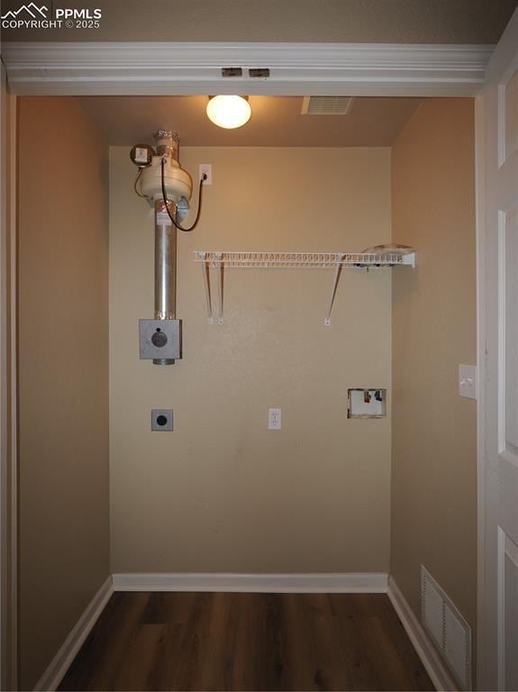 clothes washing area featuring dark hardwood / wood-style floors, hookup for a washing machine, and electric dryer hookup